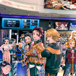 This is a pixiv picture whose title is 現代×鬼滅の刃 in 映画館.