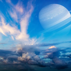 This is a pixiv picture whose title is 雲と土星の幻想.