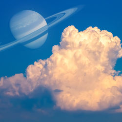 This is a pixiv picture whose title is 土星と入道雲の夕方.