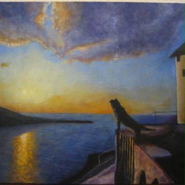沈む夕日を見る犬
