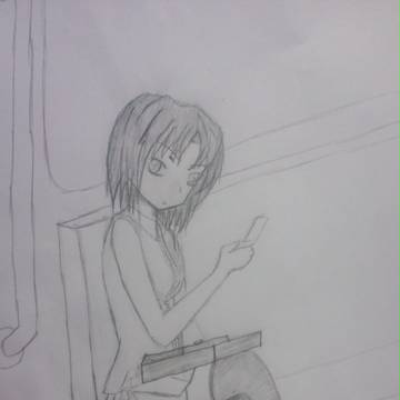 電車内で携帯をいじる少女
