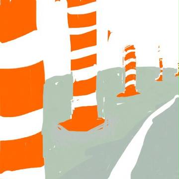 道路にある、ぶつかると曲がる赤と白の棒