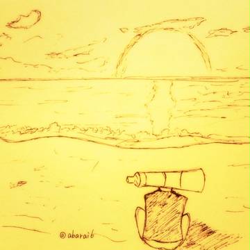 日が沈む浜辺で