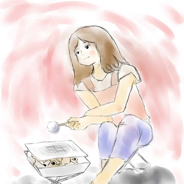 ましゅまろを焼く女性
