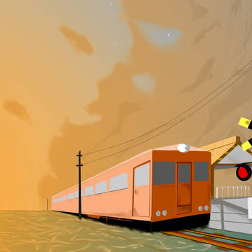 夕焼け雲と海の上の電車