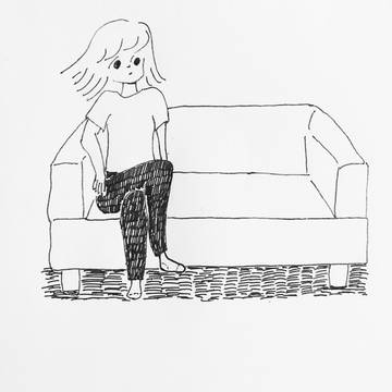 テレビのリモコンを探す女の子