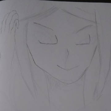 髪をかきあげる女性