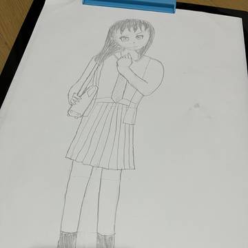 首を傾げた女子高生