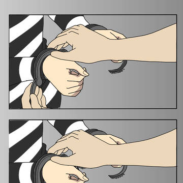 囚人服姿で手錠の瞬間