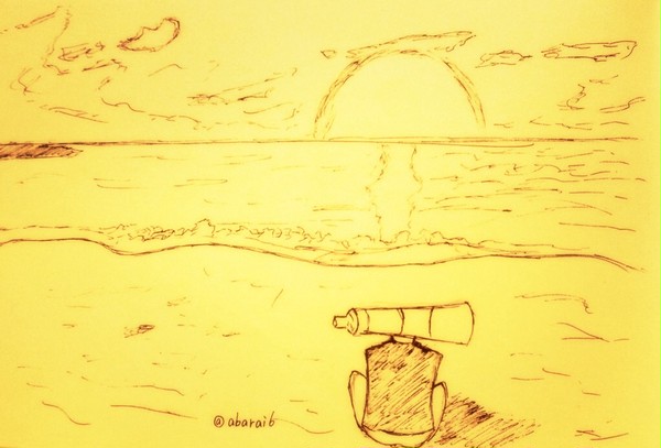 日が沈む浜辺で