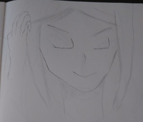 髪をかきあげる女性