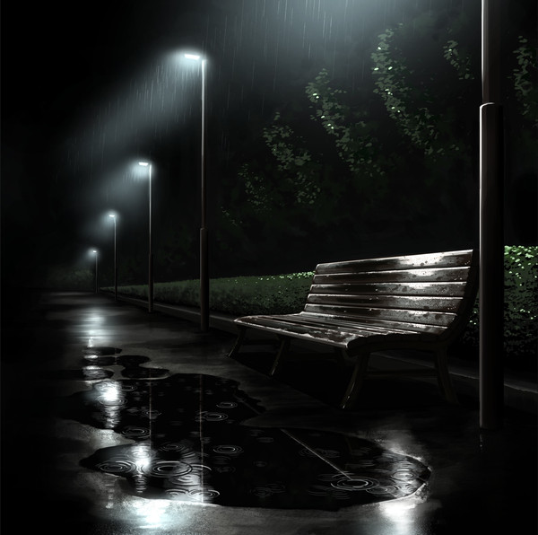 夜の雨に濡れるベンチ