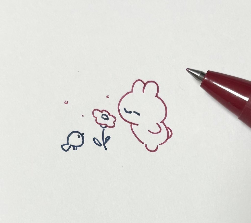 This is a pixiv picture whose title is お花の香りを楽しむちびうさぎ.